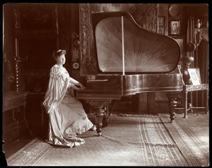 Mrs. I. M. Clark Seated at a Grand Piano, 1904